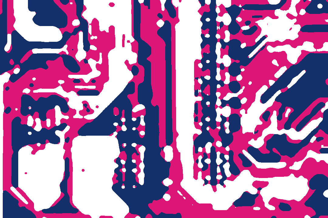 A close view of the tracks and solder points on a circuit board.