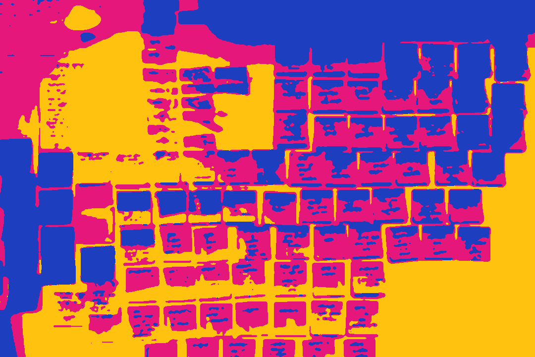A wall covered in coloured sticky notes.